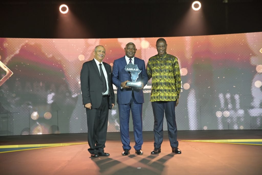 Equity Group Holdings CEO and MD Dr. James Mwangi (center) displays his Lifetime Achievement Award at the All-Africa Business Leaders Award in Sun City, South Africa. Joining him in the photo are South Africa Deputy President Paul Meshatile (right) and Dr. Rakesh Wahi (left), Co-Founder and Chairman of Africa Business News Group. Photo by MaruAnele Photografik 
