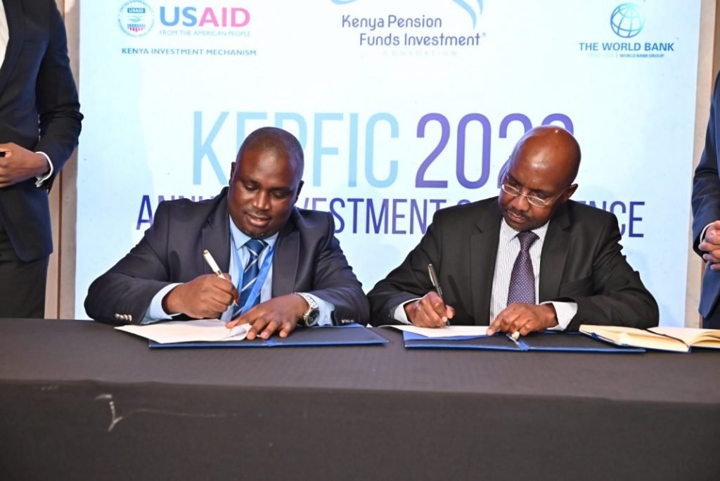 (L-R) Mr. Calvin Nyachoti Chairman, Kenya Pension Funds Investment Consortium, and Mr. Patrick Kariuki, Chairman of the Fund Managers Association, sign an MOU to cooperate in boosting pension schemes investment in alternative assets on July 21, 2023 in Nairobi.