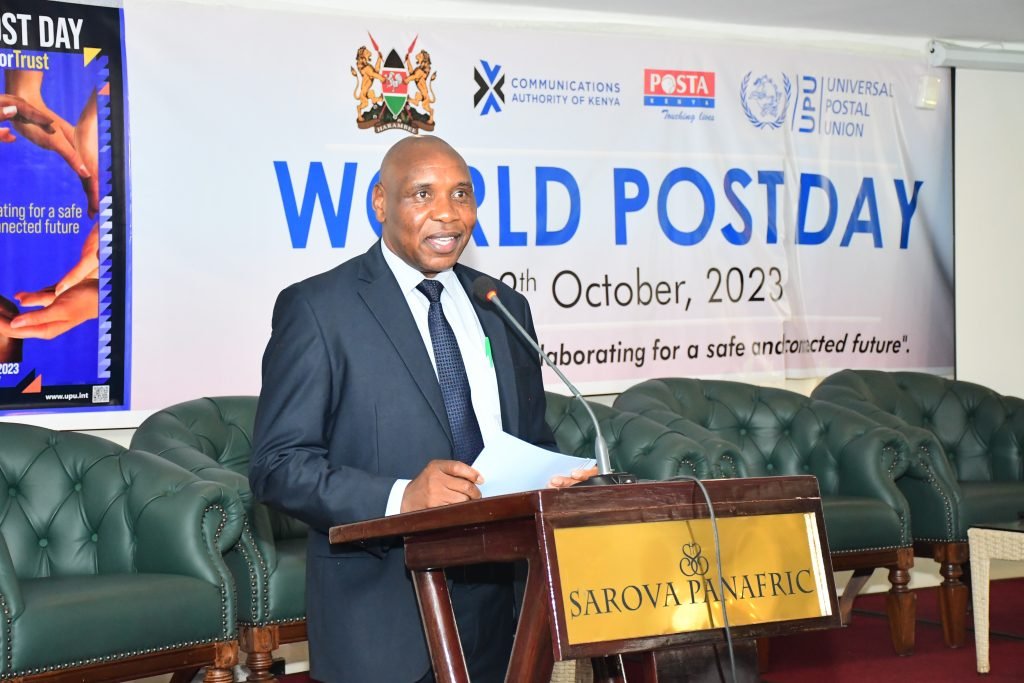 Hezron Nyamberi, the Senior Deputy Secretary, Ministry of Information, Communication and Digital Economy speaks during the World Post Day celebrations hosted by PCK. 