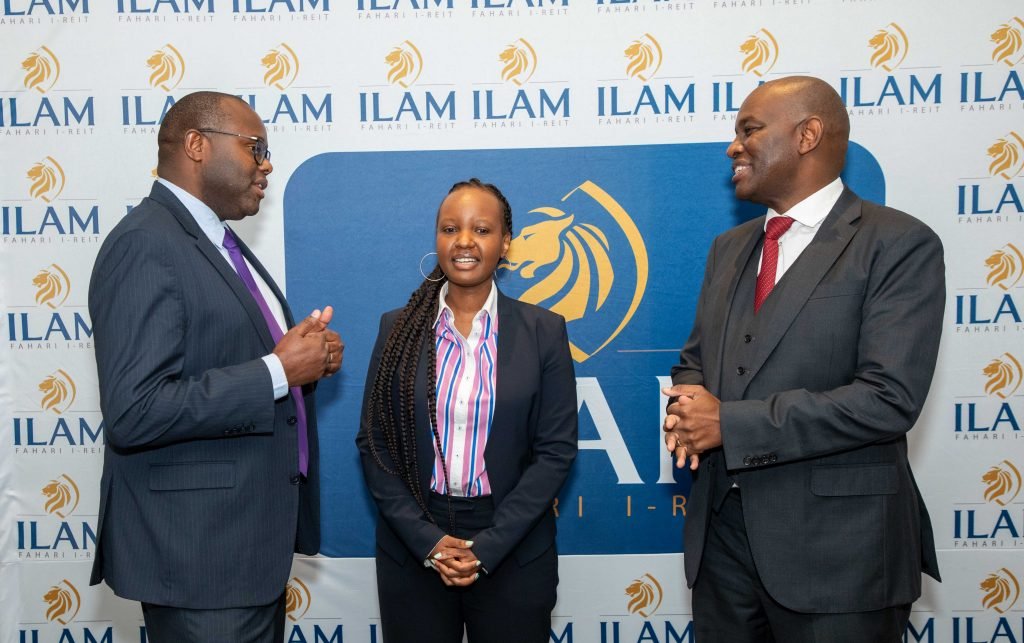 ILAM Fahari I-REIT CEO Mr Raphael Mwito (left), Dyer & Blair corporate finance director Ms Cynthia Mbaru (centre) and ILAM CEO Mr Einstein Kihanda (right) share a word during an ILAM Fahari I-REIT redemption and conversion media workshop at a Nairobi Hotel.