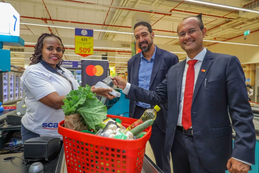 Rachid Nouri, Carrefour East Africa Regional Director for Finance, Majid Al Futtaim (centre) and Shehryar Ali, Senior Vice President and Country Manager for East Africa and Indian Ocean Islands, Mastercard (right) launch their festive season campaign offering a 20% discount for Mastercard users at Carrefour.